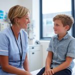 a warm, smiling nurse gently talking to a young child in a bright medical examination room